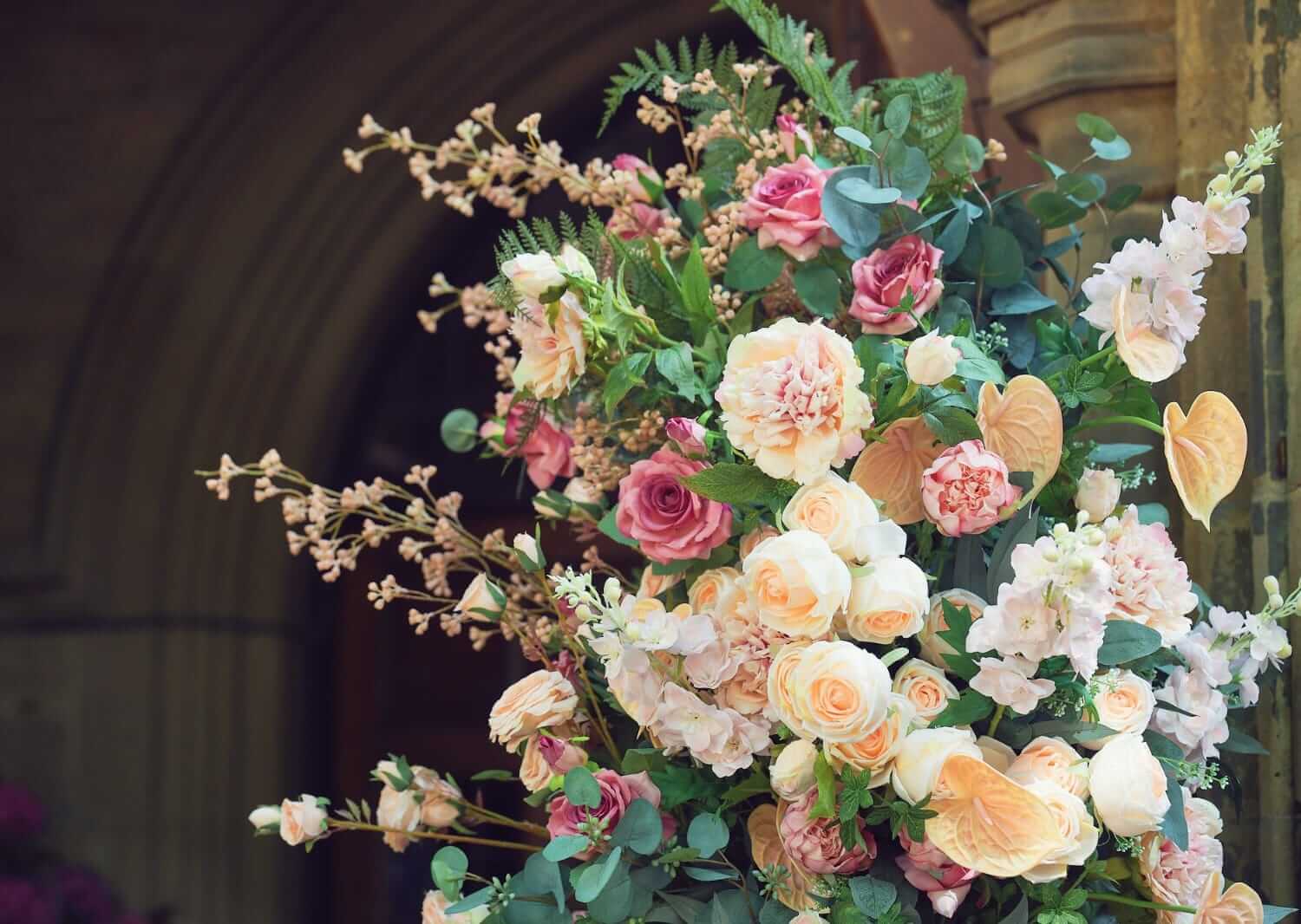 Pink and cream floral detail on one of the wedding flower columns