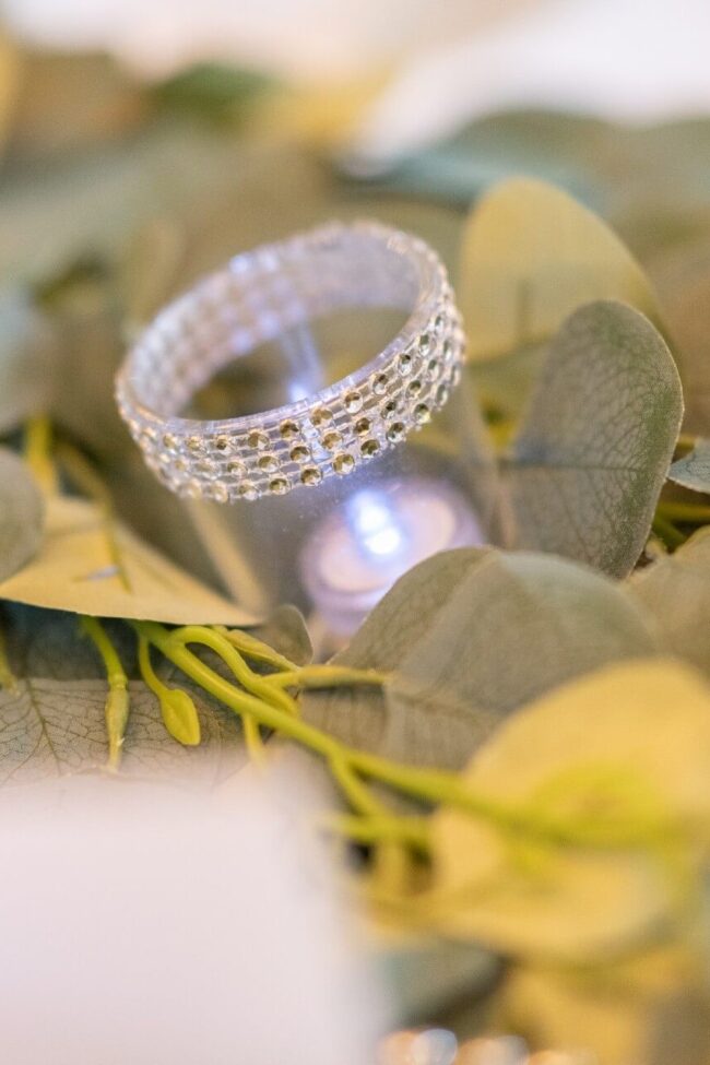 Diamante tealight holder with sparkling crystal-style detail and greenery