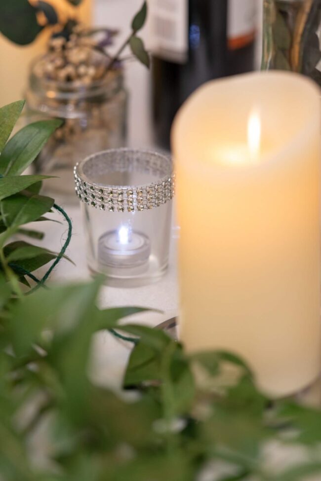 Crystal tealight holder with diamante detailing styled among greenery