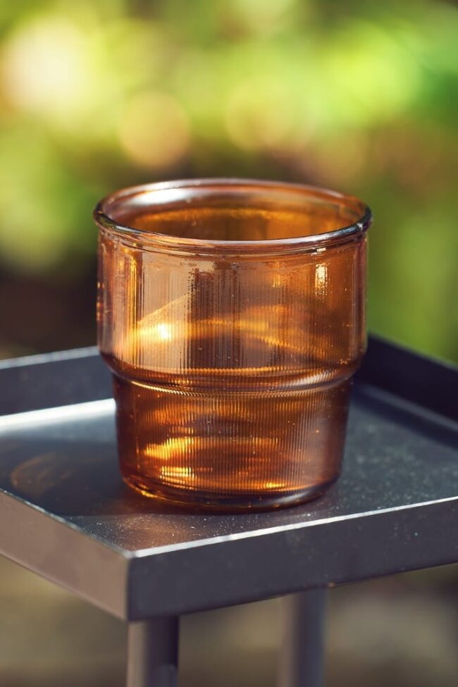 Amber glass tealight holder with warm brown glass finish